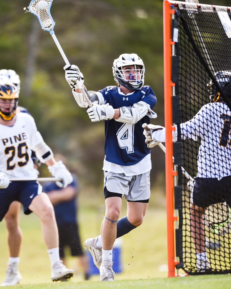 St. Edward's Oscar Lindenthal scores a goal against The Pine School in a high school boys lacrosse game Tuesday, March 22, 2022, at The Pine School in Hobe Sound. St. Edward's won 15-1.