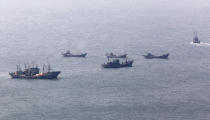 FILE - Chinese fishing boats gather near the South Korea's western Yeonpyong Island, near the disputed sea border with communist North Korea, June 1, 2009. A Chinese scientific ship bristling with surveillance equipment docked in a Sri Lankan port. Hundreds of fishing boats anchored for months at a time among disputed islands in the South China Sea. And ocean-going ferries, built to be capable of carrying heavy vehicles and large loads of people. (AP Photo/Ahn Young-joon, File)