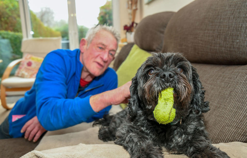 Andy Szasz with his dog Teddy after coming out of his coma. Source: Caters