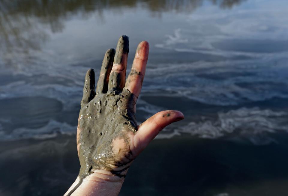 A massive Duke Energy coal ash spill coated 70 miles of the Dan River with toxic sludge in 2014.