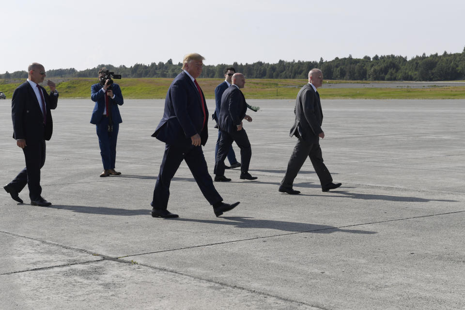 President Donald Trump walks back to Air Force One at Elmendorf Air Force Base in Anchorage, Alaska, Wednesday, June 26, 2019, after greeting troops during a refueling stop. Trump is heading to the G-20 in Japan, his third overseas trip in a month facing a flurry of international crises, tense negotiations and a growing global to-do list. (AP Photo/Susan Walsh)