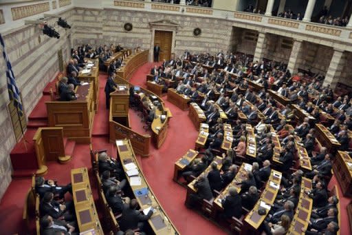 Greek Prime Minister Antonis Samaras gives his closing speech at the Greek parliament in Athens. The Greek parliament on Sunday approved a slashed 2013 budget which the government has vowed will secure the release of foreign aid vital to save the debt-ridden country from insolvency