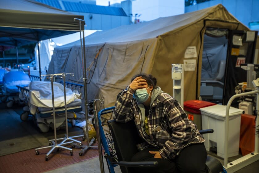 LOS ANGELES, CA - JANUARY 13: Carina Tapia waits in the ambulance bay outside the Edmergancy Department at MLK Community Hospital, (MLKCH) on Thursday, Jan. 13, 2022 in the Willowbrook neighborhood of Los Angeles, CA. (Francine Orr / Los Angeles Times)