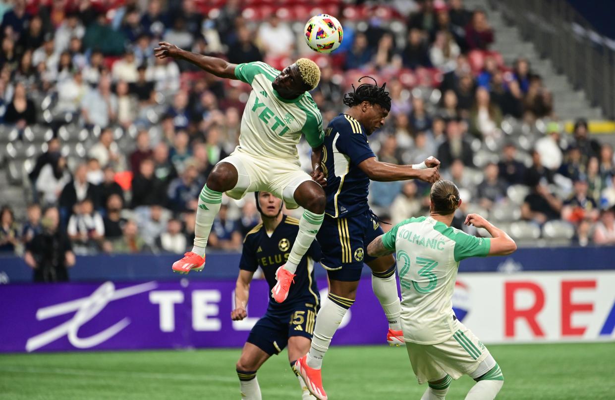 Austin FC forward Gyasi Zardes and Vancouver Whitecaps FC forward Levonte Johnson jump up for a header during the second half of Saturday night's 0-0 draw at BC Place in Vancouver. El Tree has earned points in five of its last six matches.
