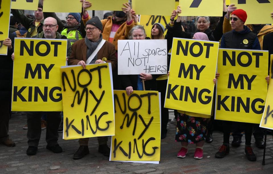 Anti-monarchy demonstrators protest against the royal family outside Westminster Abbey on 13 March 2023 (AFP via Getty Images)