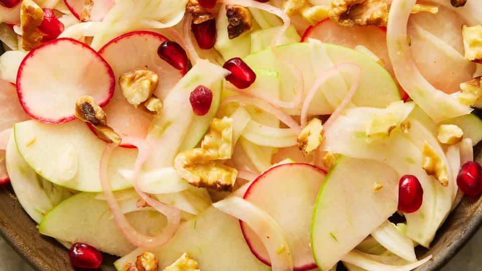 fresh fennel salad with apples, radishes, shallots, pomegranate seeds, and walnuts