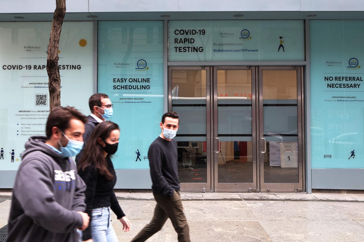 People walk past the BioReference coronavirus (COVID-19) testing site on Lexington Avenue on April 01, 2021 in New York City.