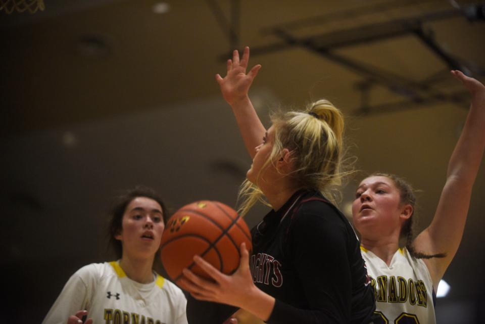 Aberdeen Christian's Mallory Miller swarmed by Centerville defenders as she readies a shot during the SoDak 16 at the Corn Palace on March 3, 2022.