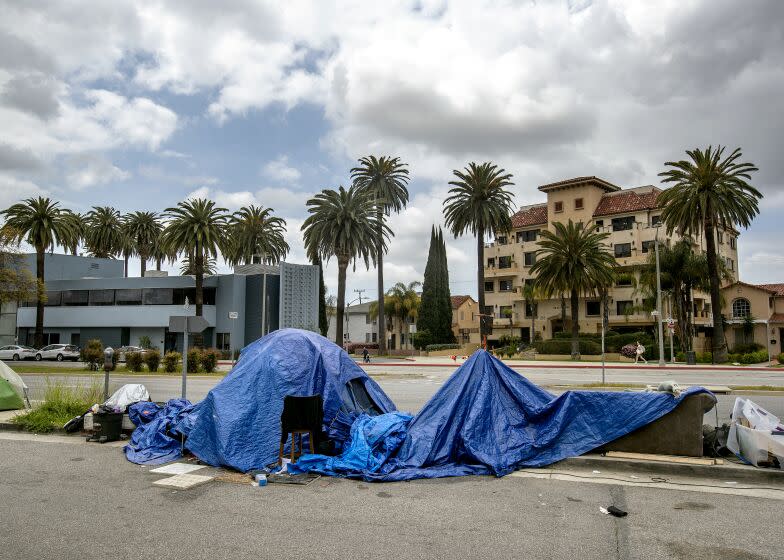 LOS ANGELES, CA-APRIL 14, 2023: A homeless encampment is located on the east side of San Vicente Blvd. just south of the Beverly Center in the city of Los Angeles. (Mel Melcon / Los Angeles Times)