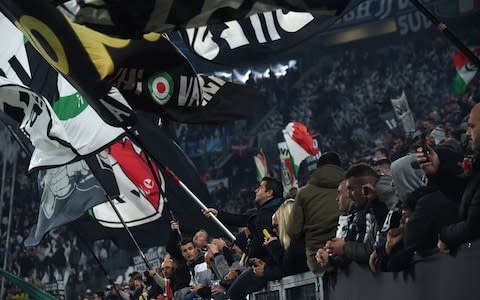 Juve fans are having a ball - Credit: FILIPPO MONTEFORTE/AFP