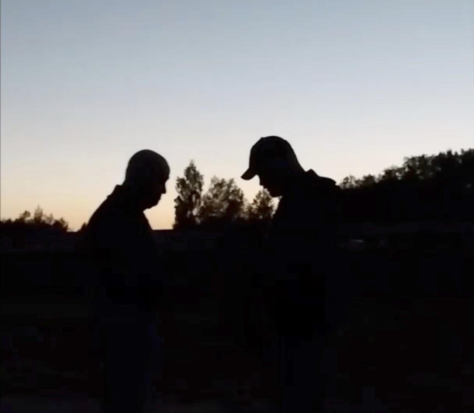 This image from video released Wednesday, July 19, 2023, appears to show Russian mercenary chief Yevgeny Prigozhin, left, for the first time since he led a short-lived rebellion in June. The grainy video of him speaking to troops at a field camp purportedly in Belarus, was posted on a messaging app channel linked to Prigozhin's Wagner private military company. (AP Photo)