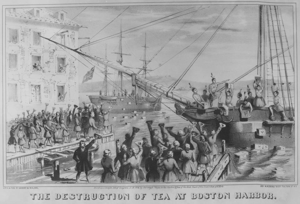 Colonists dumping tea into the Boston Harbor.