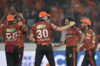 Sunrisers Hyderabad's Bhuvneshwar Kumar, second from right, celebrates the wicket of Lucknow Super Giants' Marcus Stoinis with captain Pat Cummins during the Indian Premier League cricket match between Sunrisers Hyderabad and Lucknow Super Giants in Hyderabad, India, Wednesday, May 8, 2024. (AP Photo/Mahesh Kumar A.)