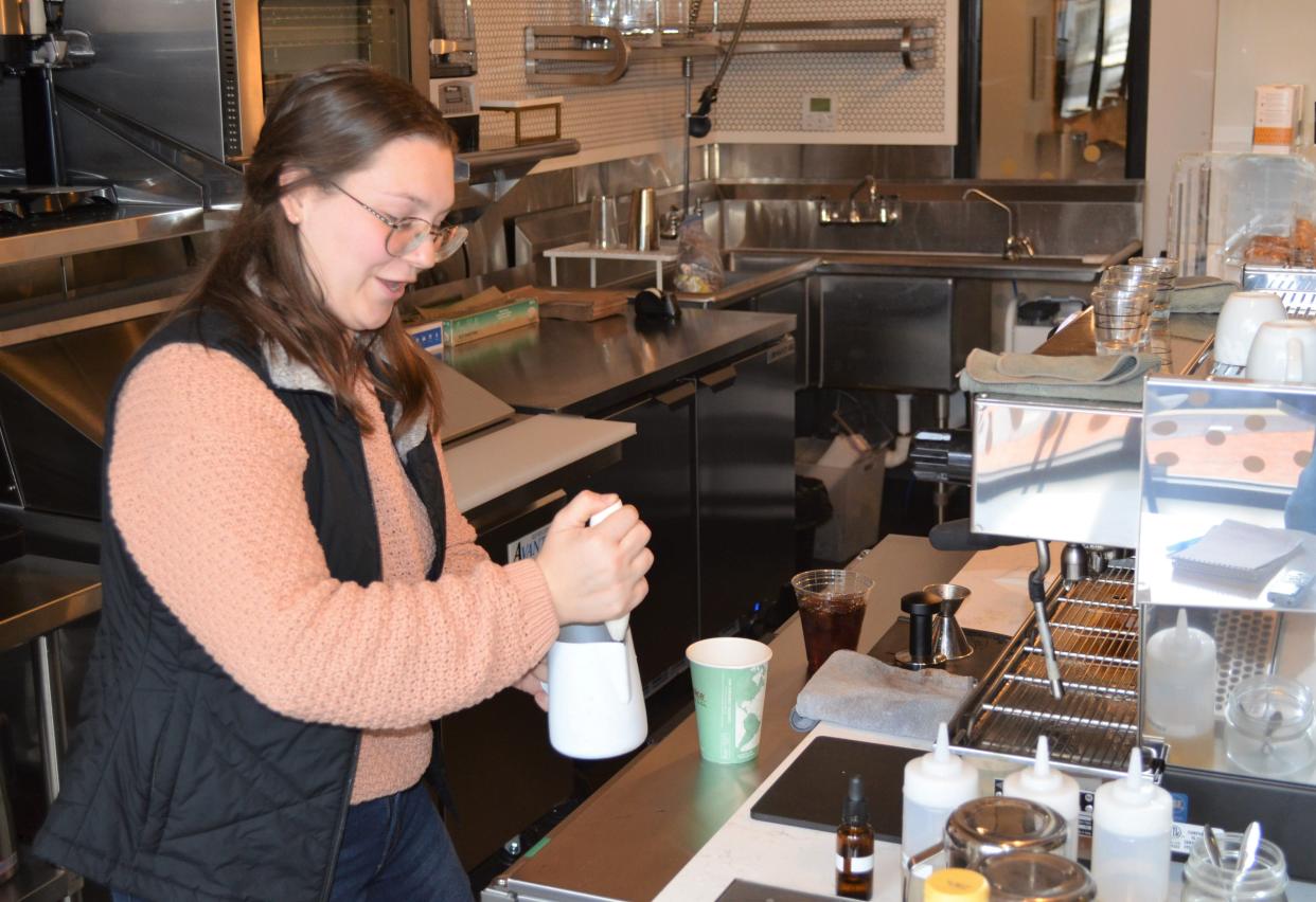 Manager Ruby Eagle makes a iced mocha for a customer at the Giving Cup BC, a new coffee shop in downtown Battle Creek.