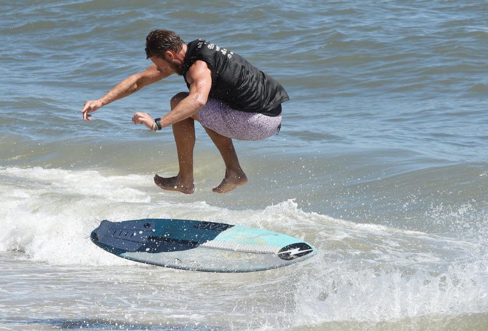 A skimboarder at the 40th Annual Pro/Am World Championships of Skimboarding in Dewey Beach.