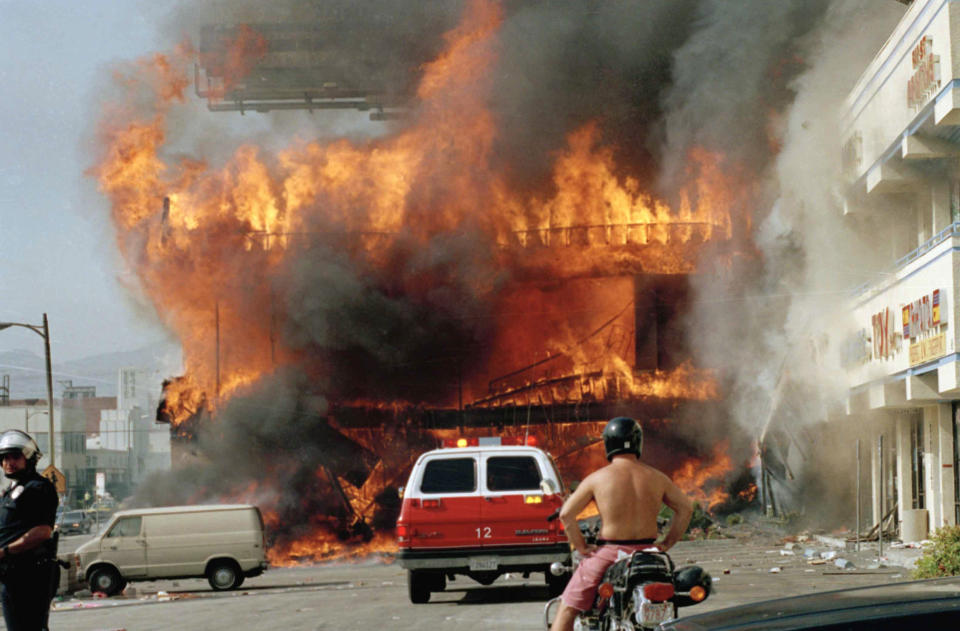 Image: A Korean shopping mall burns at Third Street and Vermont Avenue in Los Angeles on April 30, 1992  on the second day of rioting in the city following the Rodney King assault. (Nick Ut / AP file)