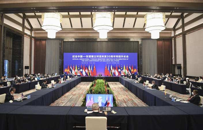 In this photo released by Xinhua News Agency, a special ASEAN-China Foreign Ministers' Meeting in Celebration of the 30th Anniversary of Dialogue Relations co-chaired by Chinese State Councilor and Foreign Minister Wang Yi and Teodoro Locsin, foreign secretary of the Philippines that serves as the current country coordinator for ASEAN-China relations and attended by foreign ministers from ASEAN countries held in Chongqing, southwestern China, June 7, 2021. China is hosting foreign ministers from 10 Southeast Asian nations this week in the southwestern megacity of Chongqing amid heightened competition between Beijing and Washington for influence in the region. (Wang Quanchao/Xinhua via AP)