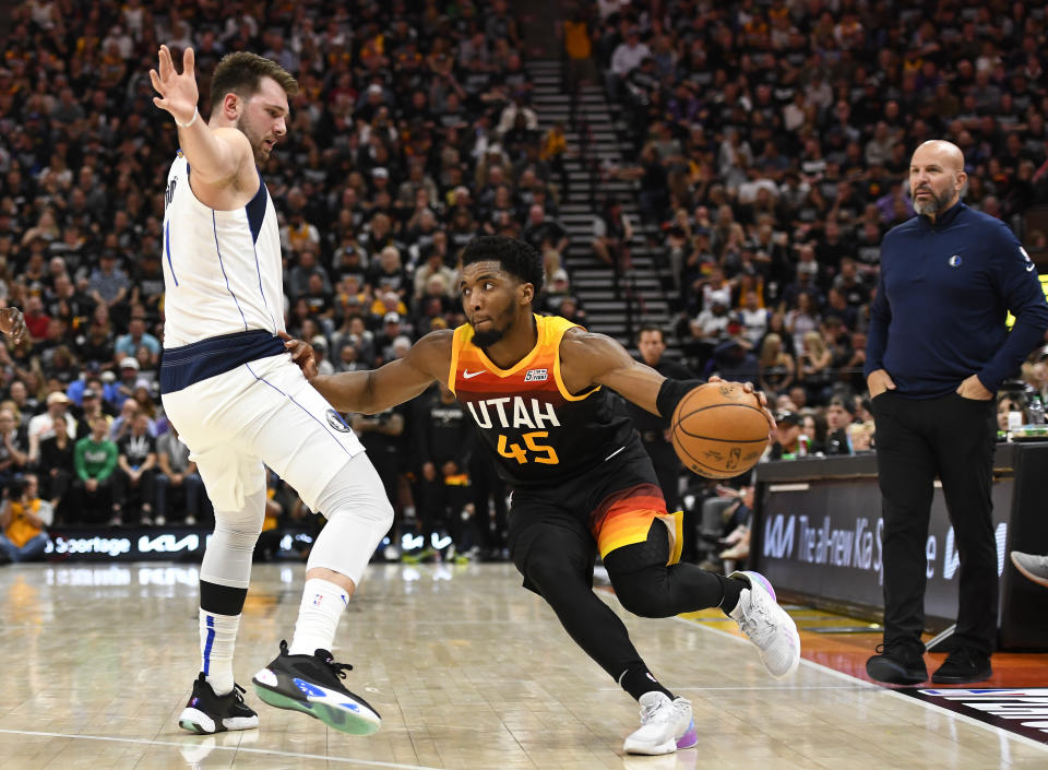 SALT LAKE CITY, UTAH - APRIL 28: Donovan Mitchell #45 of the Utah Jazz drives under Luka Doncic #77 of the Dallas Mavericks during the second half of Game 6 of the Western Conference First Round Playoffs at Vivint Smart Home Arena on April 28, 2022 in Salt Lake City, Utah. NOTE TO USER: User expressly acknowledges and agrees that, by downloading and/or using this Photograph, user is consenting to the terms and conditions of the Getty Images License Agreement. (Photo by Alex Goodlett/Getty Images)