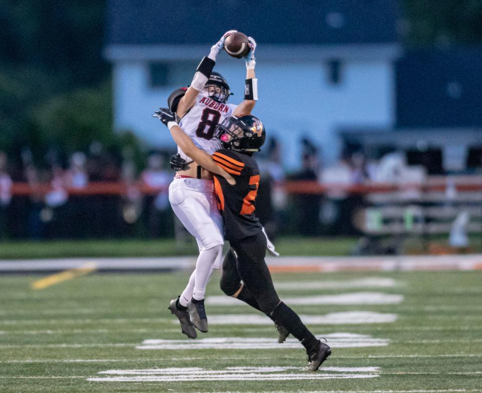 Auburn's Athavion Coleman goes up for the catch on Saturday, Aug. 27, 2022, at Harlem High School in Machesney Park.