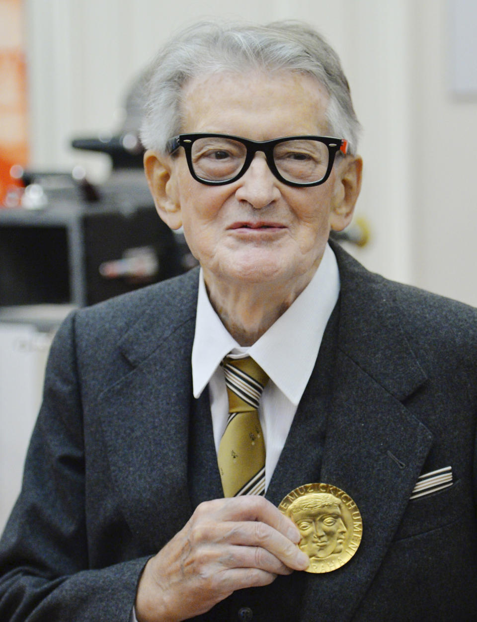 FILE - In this November 30, 2015, file photo, Vojtech Jasny, Czech film director and scriptwriter, poses for photographers as he receives gold medal of Academy of Performing Arts in Prague (AMU) on the occasion of his 90th birthday and AMUs 70th anniversary in Prague, Czech Republic. Vojtech Jasny has died on Friday, Nov. 15, 2019, at the age of 93 years. (Michal Dolezal/CTK via AP)