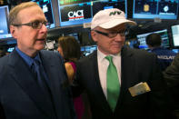 FILE PHOTO: Seattle Seahawks owner and Microsoft co-founder Paul Allen (L) and New York Jets owner Woody Johnson walk on the floor at the New York Stock Exchange prior to ringing the opening bell January 30, 2014. REUTERS/Brendan McDermid/File Photo