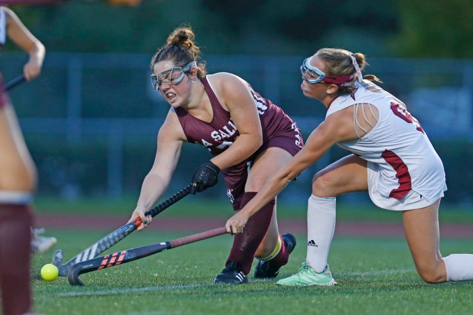 La Salle's Emily Dubord tries to shoot around East Greenwich's Maeve Kiernan during a September game.