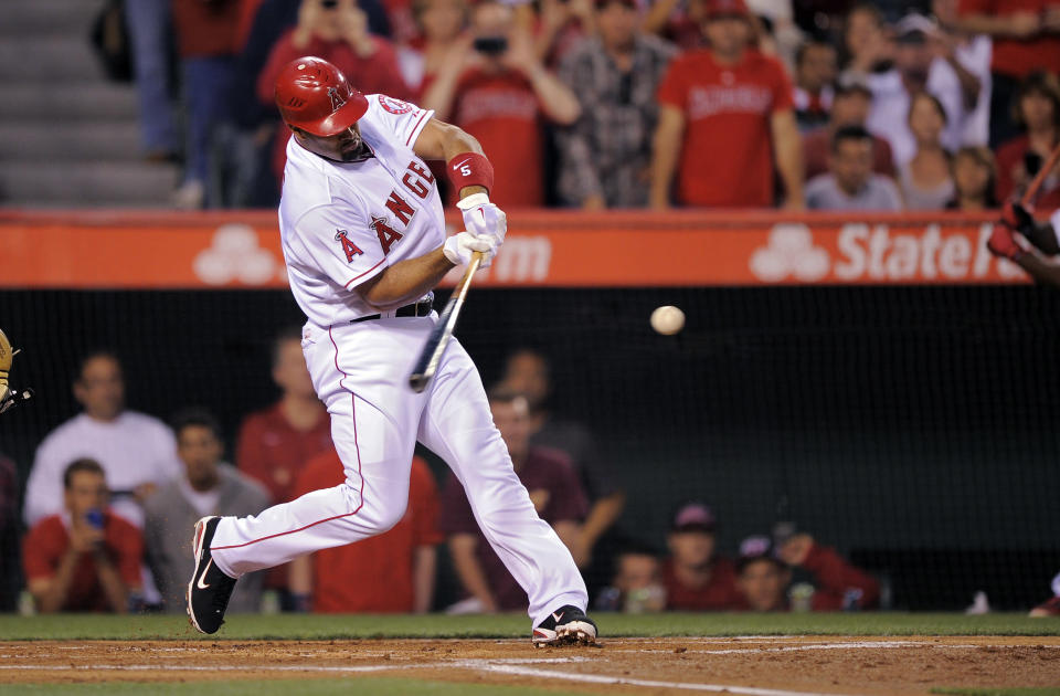 Los Angeles Angels' Albert Pujols hits into a double play during the first inning of baseball game against the Kansas City Royals, Friday, April 6, 2012, in Anaheim, Calif. (AP Photo/Mark J. Terrill)