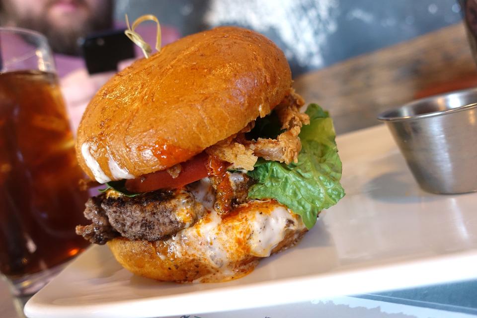 Beef tatanka burger with Buffalo sauce, crispy onions and gorgonzola cream at Peoria Artisan Brewery in Peoria.