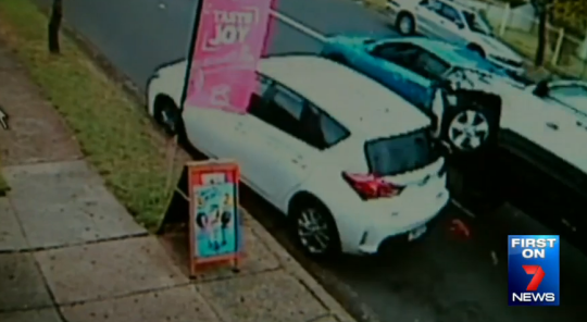 CCTV shows the car flipped on its side during the crash.