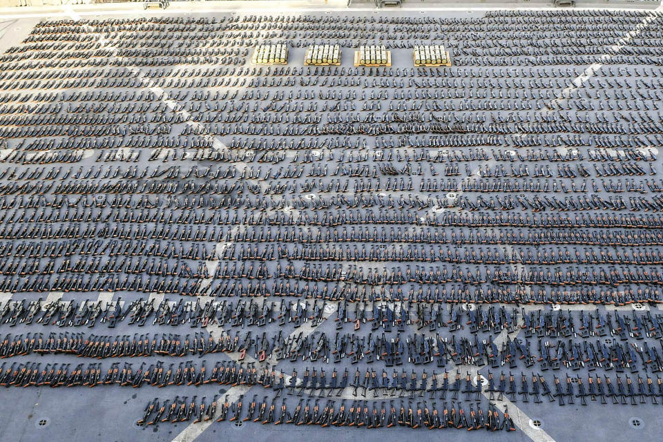 Assault rifles and missiles seized by the French navy lay on the deck of a ship at an undisclosed location Wednesday, Feb. 1, 2023. French naval forces in January seized thousands of assault rifles, machine guns and anti-tank missiles in the Gulf of Oman coming from Iran heading to Yemen’s Houthi rebels, officials said Thursday, the latest such interdiction amid the Mideast nation’s long-running war. (U.S. military's Central Command via AP)