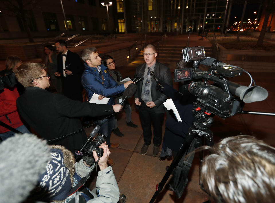 Michael Baca, center, speaks after arguments in a lawsuit were heard Monday, Dec. 12, 2016, outside the federal courthouse in downtown Denver. Baca and a Democratic elector are trying to be freed of Colorado's requirement that they vote for the winner of the state's popular vote in the presidential election this past November. (AP Photo/David Zalubowski)