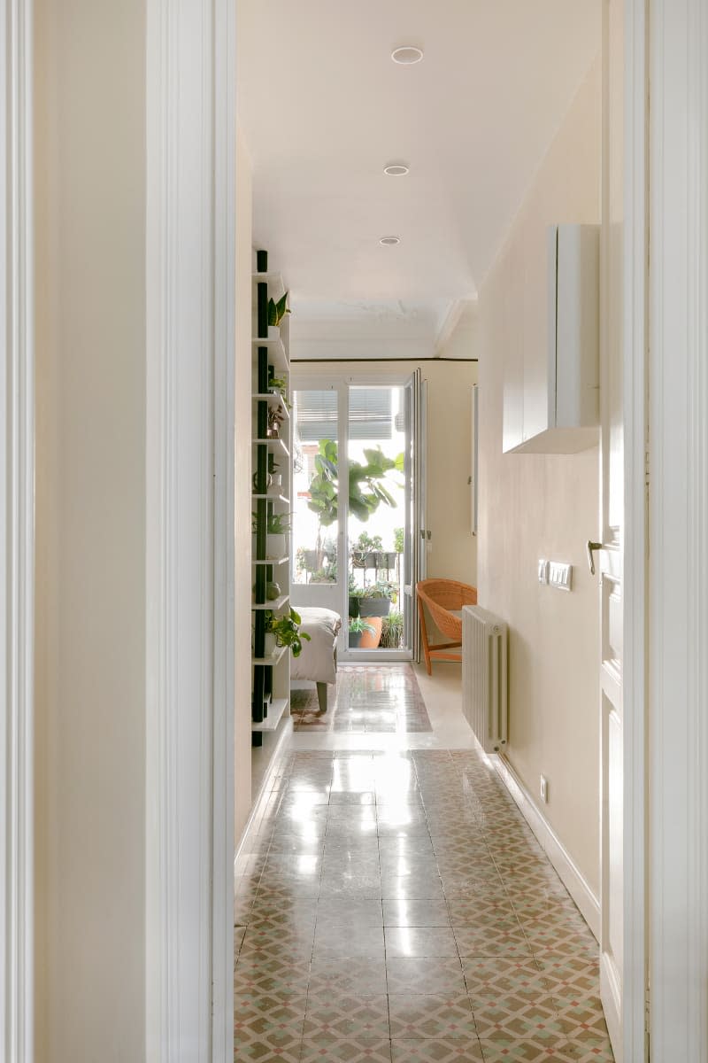 Light and airy hallway with vintage tile floor