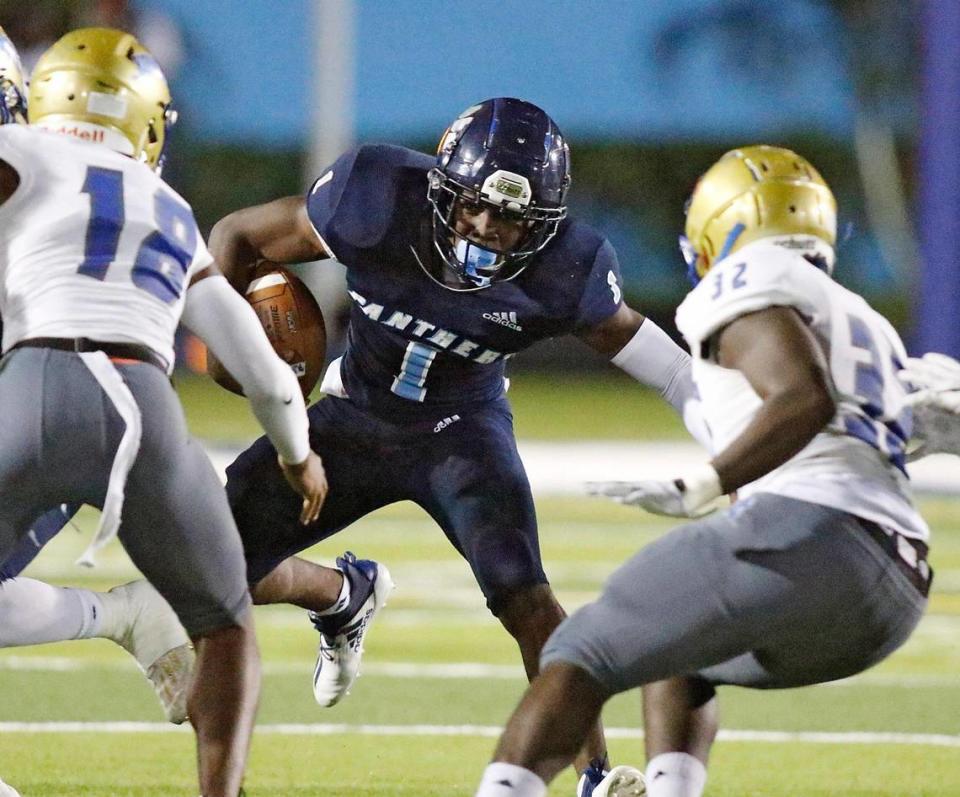 Palmetto Panthers Brashard Smith (1) looks for way to escape a tackle during the FHSAA Class 8A state semifinal football game against Osceola Kowboys on Saturday, December 12, 2020 at Traz Powell stadium in Miami