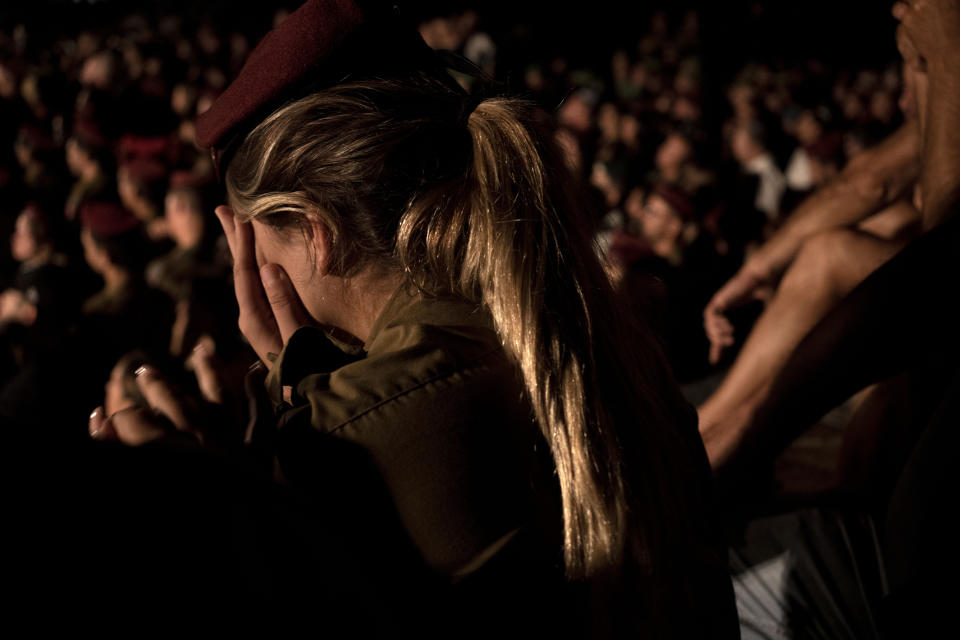 An Israeli Army soldier weeps at the funeral for Maj. Bar Falah, killed during a West Bank operation, in Netanya, Israel, Wednesday, Sept. 14, 2022. Palestinian gunmen opened fire on Israeli troops near a military checkpoint in the occupied West Bank Wednesday, killing Maj. Falah, Israel's military said. Palestinian officials said that troops killed the two gunmen.(AP Photo/ Maya Alleruzzo)