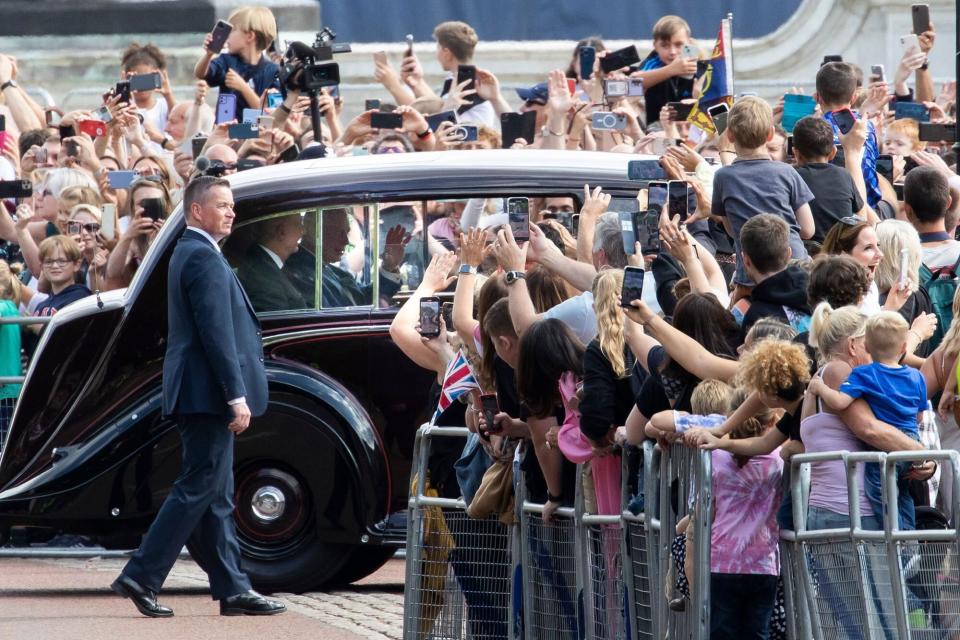 Mandatory Credit: Photo by George Cracknell Wright/LNP/Shutterstock (13381957au) King Charles III waves as he is driven into Buckingham Palace. Earlier this week Britain's longest reigning monarch ,Queen Elizabeth II, passed away at Balmoral Castle at the age of 96. Death of Queen Elizabeth II, London, UK - 11 Sep 2022