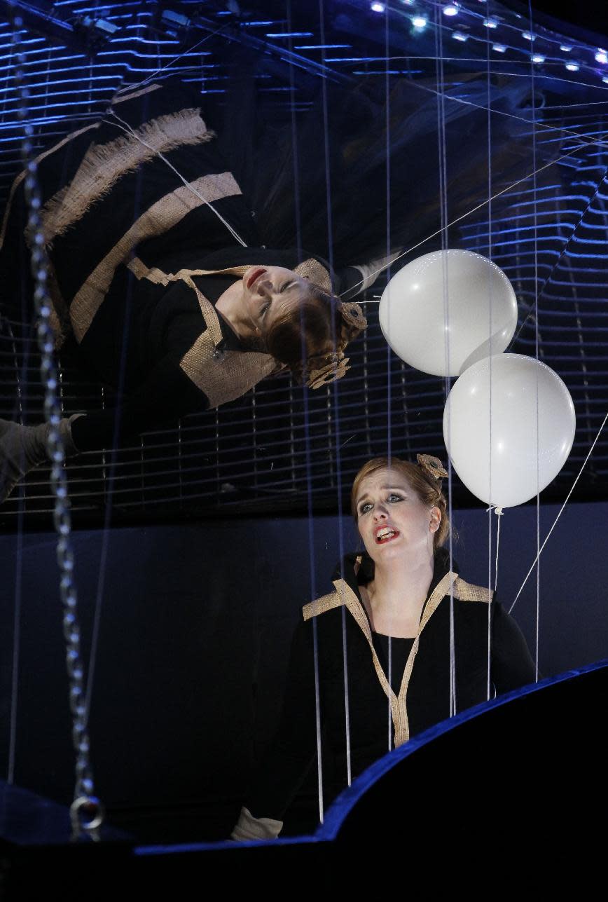 In this Feb. 24, 2012 photo, Julia Kleiter plays Almirena, in a harpsichord shaped trap set by Armida, during the final dress rehearsal at the Lyric Opera of Chicago's production of Rinaldo. (AP Photo/Charles Rex Arbogast)