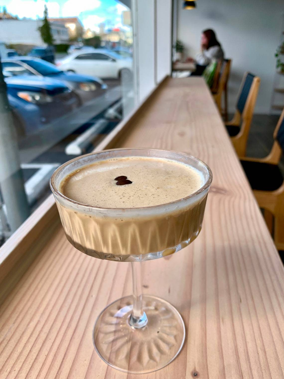 Common Ground Coffee is an airy, spacious cafe near downtown Tacoma with a creative menu of hot and cold espresso drinks served in cocktail-ware, like this refreshing “Honey Kiss” shakerato.