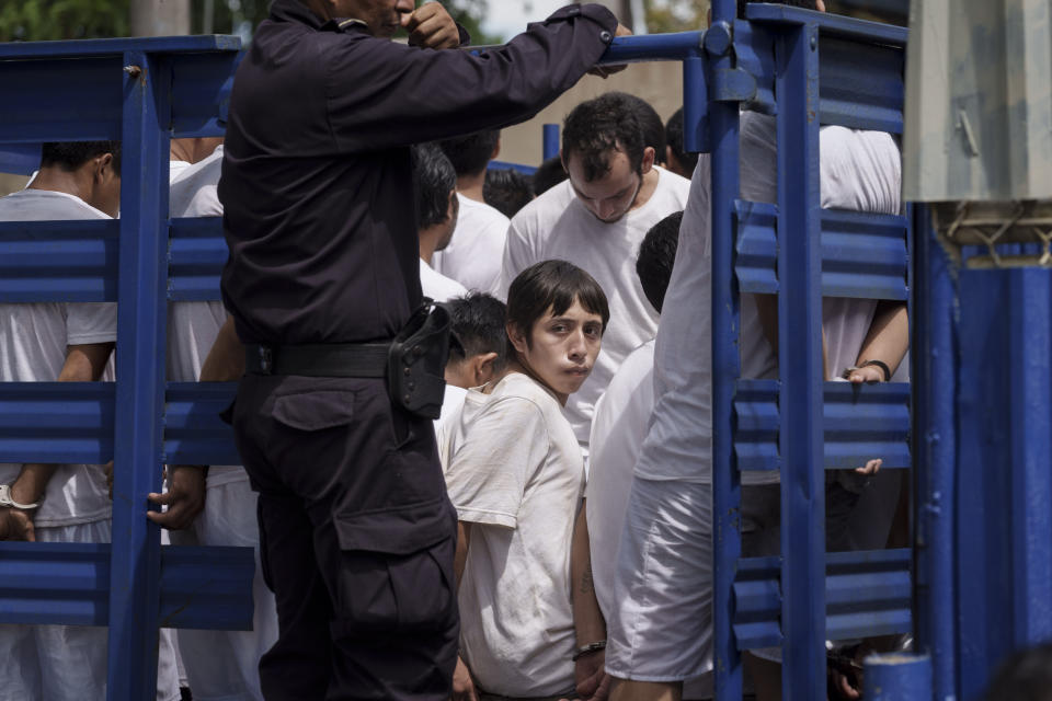 FILE - Men who were detained under a state of exception are transported in a livestock trailer to a detention center in Soyapango, El Salvador, on Oct. 7, 2022. On April 2022, El Salvador President Nayib Bukele received special powers suspending fundamental rights like access to a lawyer or being informed of why you were arrested, powers that by Nov. 2023 remain in effect. (AP Photo/Moises Castillo, File)