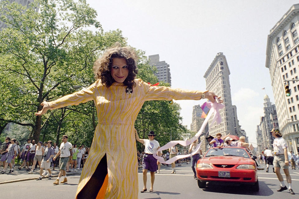 Stonewall veteran Sylvia Rivera leads the ACT-UP march past New York's Madison Square Park, June 26, 1994. The march was one of two held on Sunday to commemorate the 25th anniversary of the riot at the Stonewall Inn, a Greenwich Village bar that erupted in violence during a police raid in 1969. The incident is now considered the start of the gay rights movement. Virtually every reliable account credits Sylvia, a man who prefers the feminine pronoun, with a major role in the riot. (AP Photo/Justin Sutcliffe)