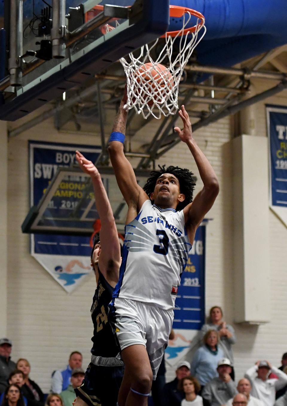 Decatur's Trybe Wise (3) dunks against Severna Park in the 3A East Region Final Tuesday, March 5, 2024, in Berlin, Maryland. The Seahawks defeated the Falcons 63-55.