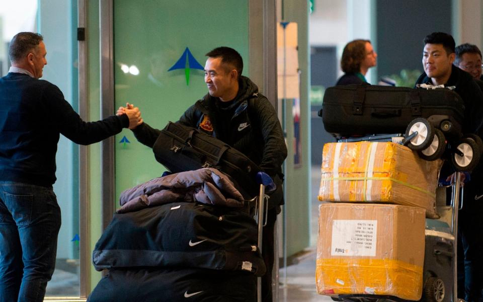 Members of Wuhan Zall FC Chinese football team arrive at the Malaga's Costa del Sol Airport on January 29, 2020  - Jorge Guerrero/AFP