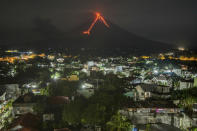 <p>Lava cascades down the slopes of the Mayon volcano seen from Legazpi city, Albay province, 340 kilometers (210 miles) southeast of Manila, Philippines, Tuesday, Jan. 16, 2018. (Photo: Dan Amaranto/AP) </p>
