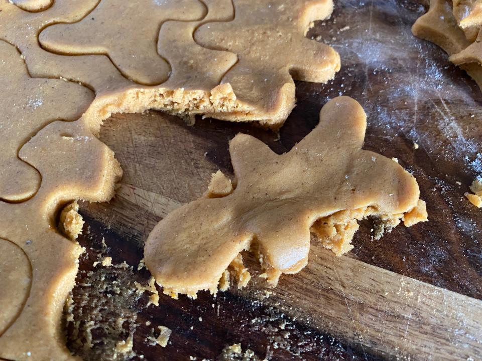 making shapes for Alex Guarnaschelli gingerbread cookies