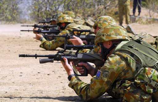 Photo illustration shows Australian soliders on a rifle range. Australian Defence Minister Stephen Smith was Friday forced to defend deep spending cuts after the announcement was called the worst day for national security since the Vietnam war ended in 1975