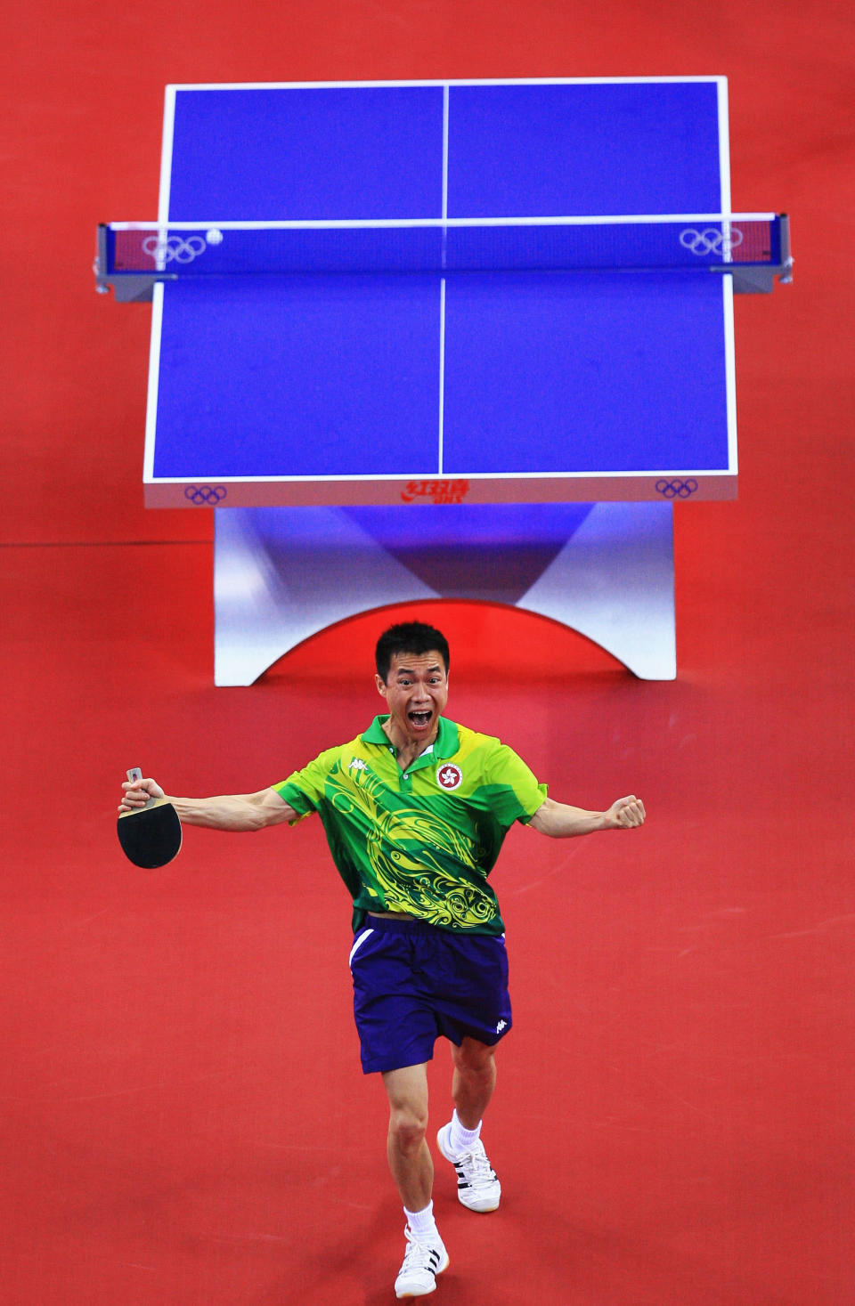 BEIJING - AUGUST 15: Li Ching of Hong Kong China celebrates after defeating Chiang Peng-Lung of Chinese Taipei during a Men's Team Bronze Play-off Round 1 match at the Peking University Gymnasium on Day 7 of the Beijing 2008 Olympic Games on August 15, 2008 in Beijing, China. (Photo by Jamie Squire/Getty Images)