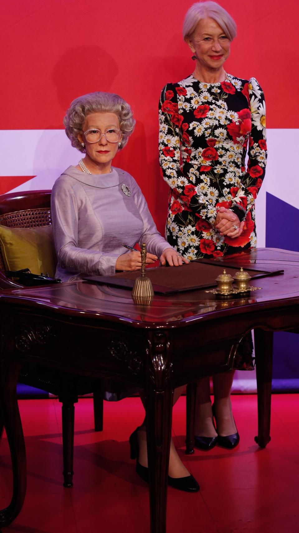 Helen Mirren next to a waxwork of the late Queen Elizabeth