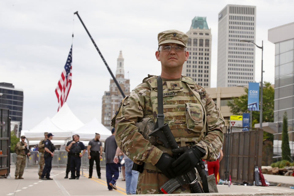 The National guard stands outside the BOK Center where President Trump will hold a rally in Tulsa, Okla., Saturday, June 20, 2020. (AP Photo/Sue Ogrocki)