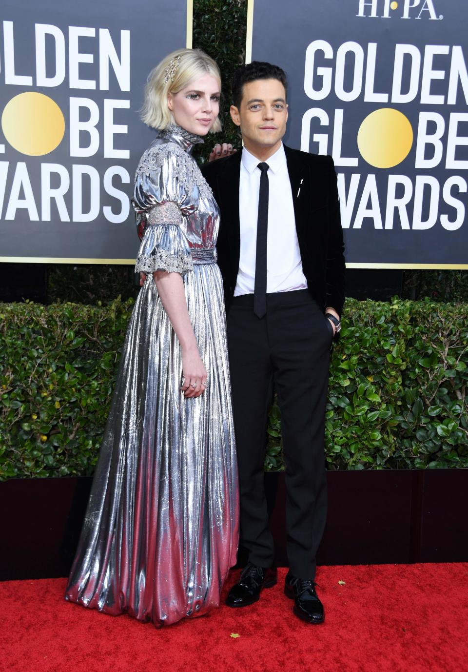 Rami Malek and actress Lucy Boynton arrive for the 77th annual Golden Globe Awards.