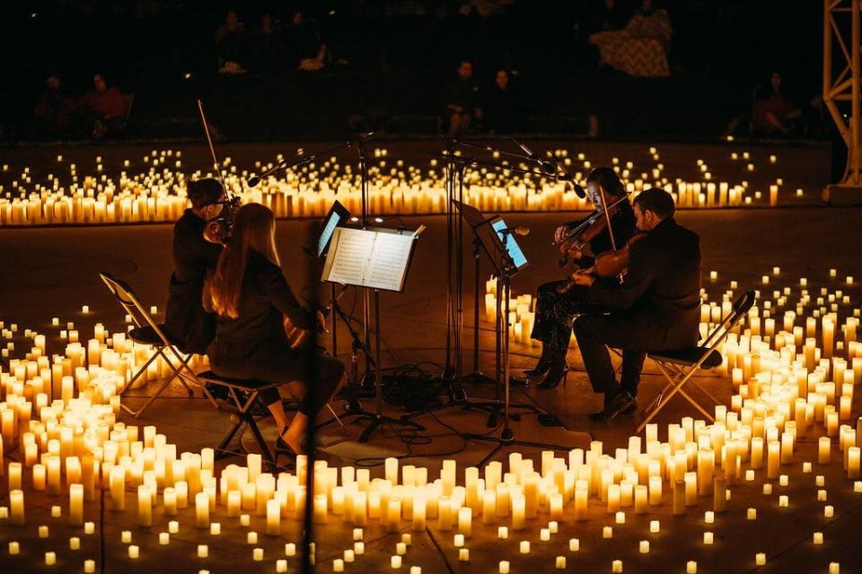 All aglow: The Candlelight Concert Series features a string quartet playing classical and popular music in the round.