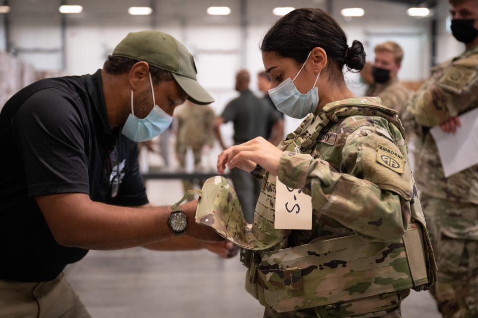 Sgt. Katiushka Rivera, assigned to the 82nd Airborne Division, gets fitted for a modular scalable vest (MSV) during a fielding event in Fort Bragg, North Carolina, conducted by PEO Soldier. (Jason Amadi/Army)